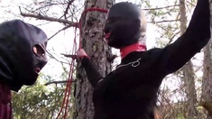 tied to a tree, rammed in her throat