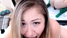 Masturbating busty blonde teen on couch with big toys