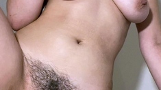 Busty curly brunette with big boobs fucks on couch