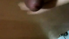 Korean girl sucks cock in a bathroom gloryhole and gets cum